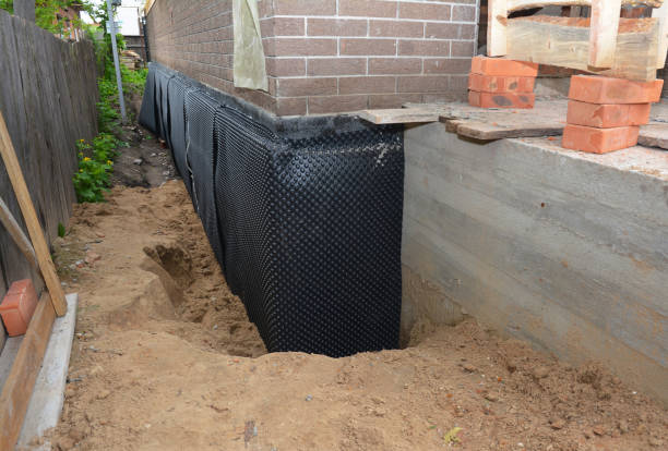 Happy homeowners after waterproofing job in Collegedale